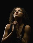 Beautiful young woman praying