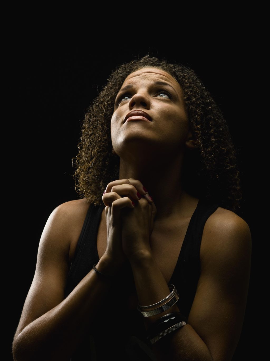 Beautiful young woman praying