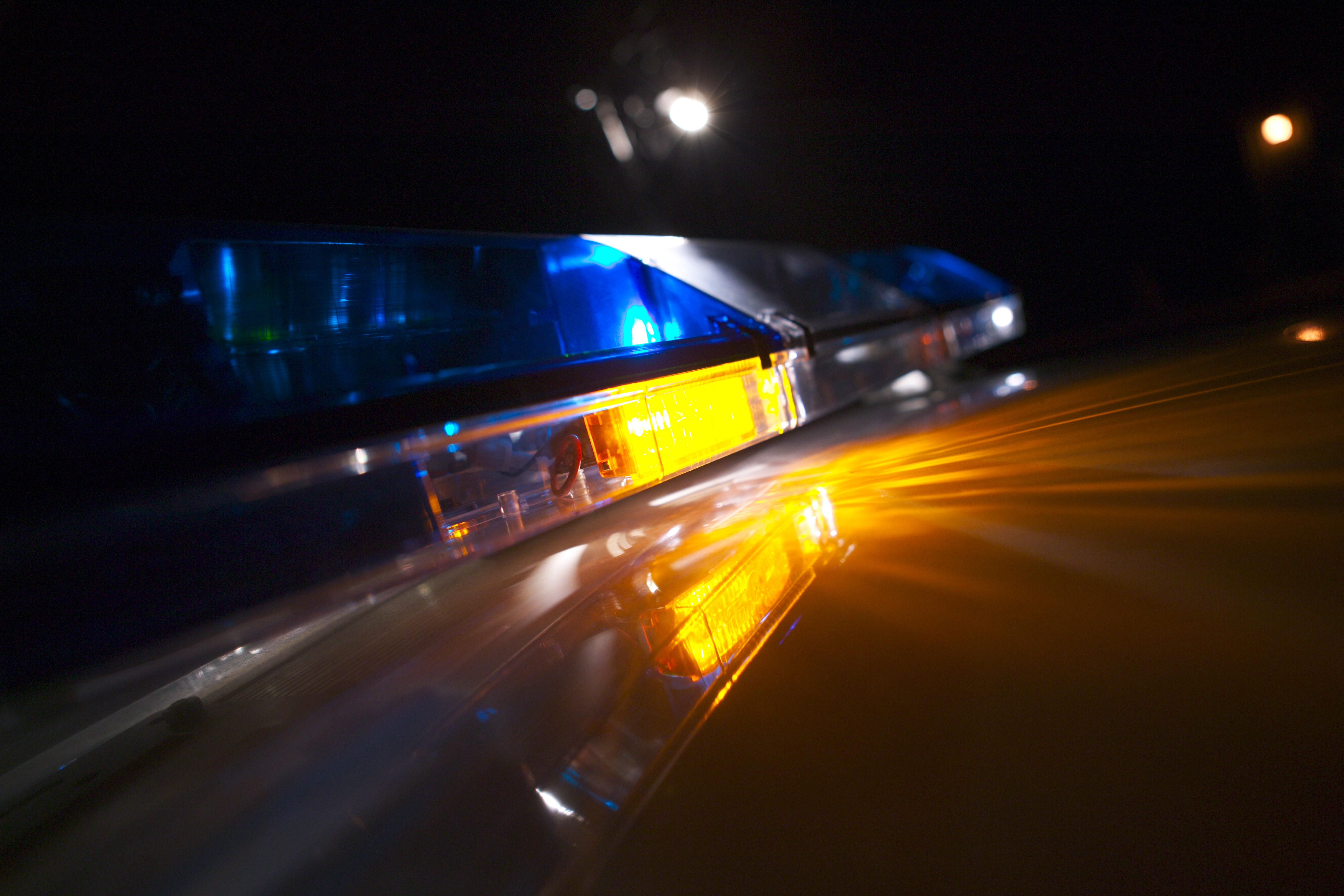 Close-up of a police car's flashing blue lights
