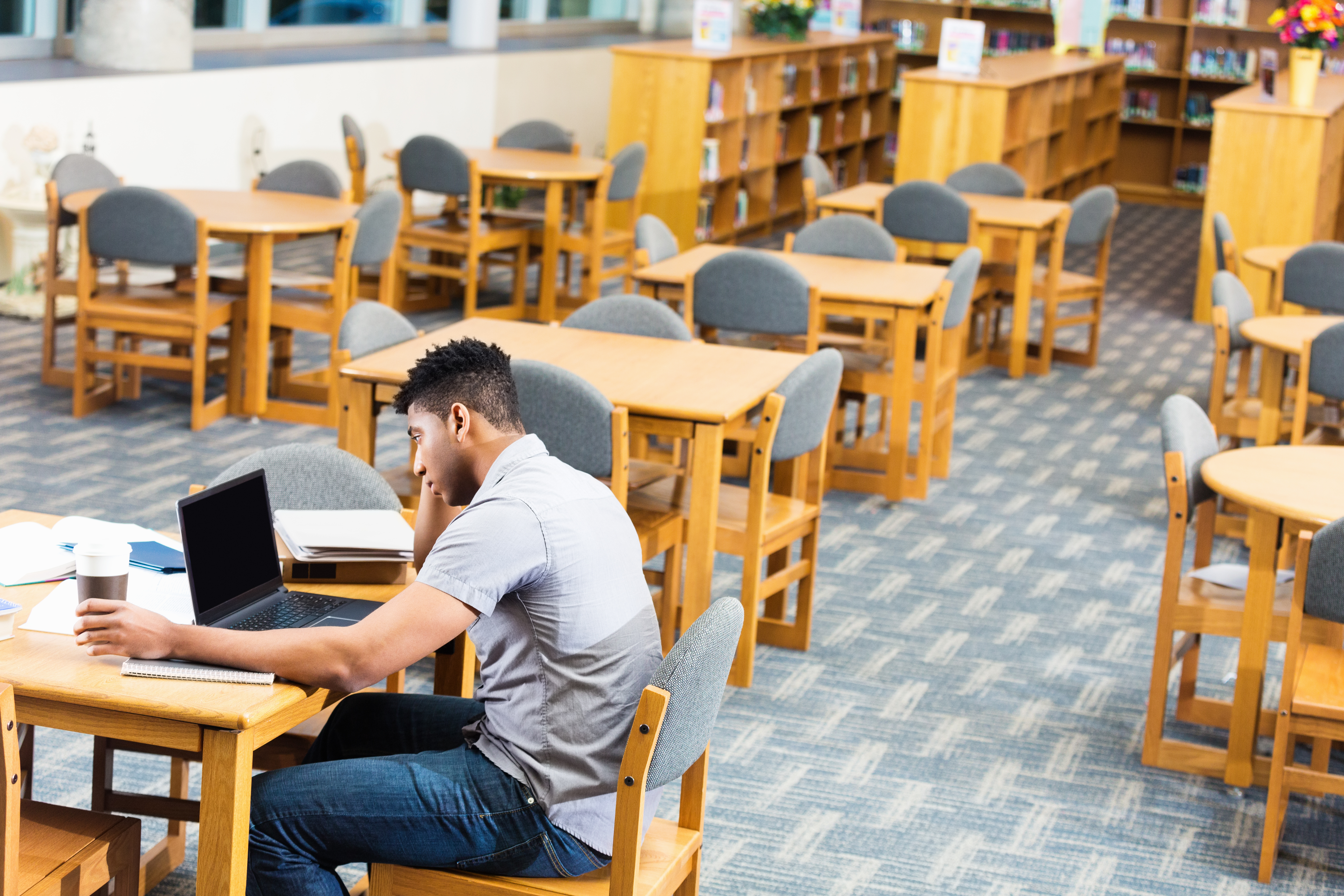 African American high school or college student studying late