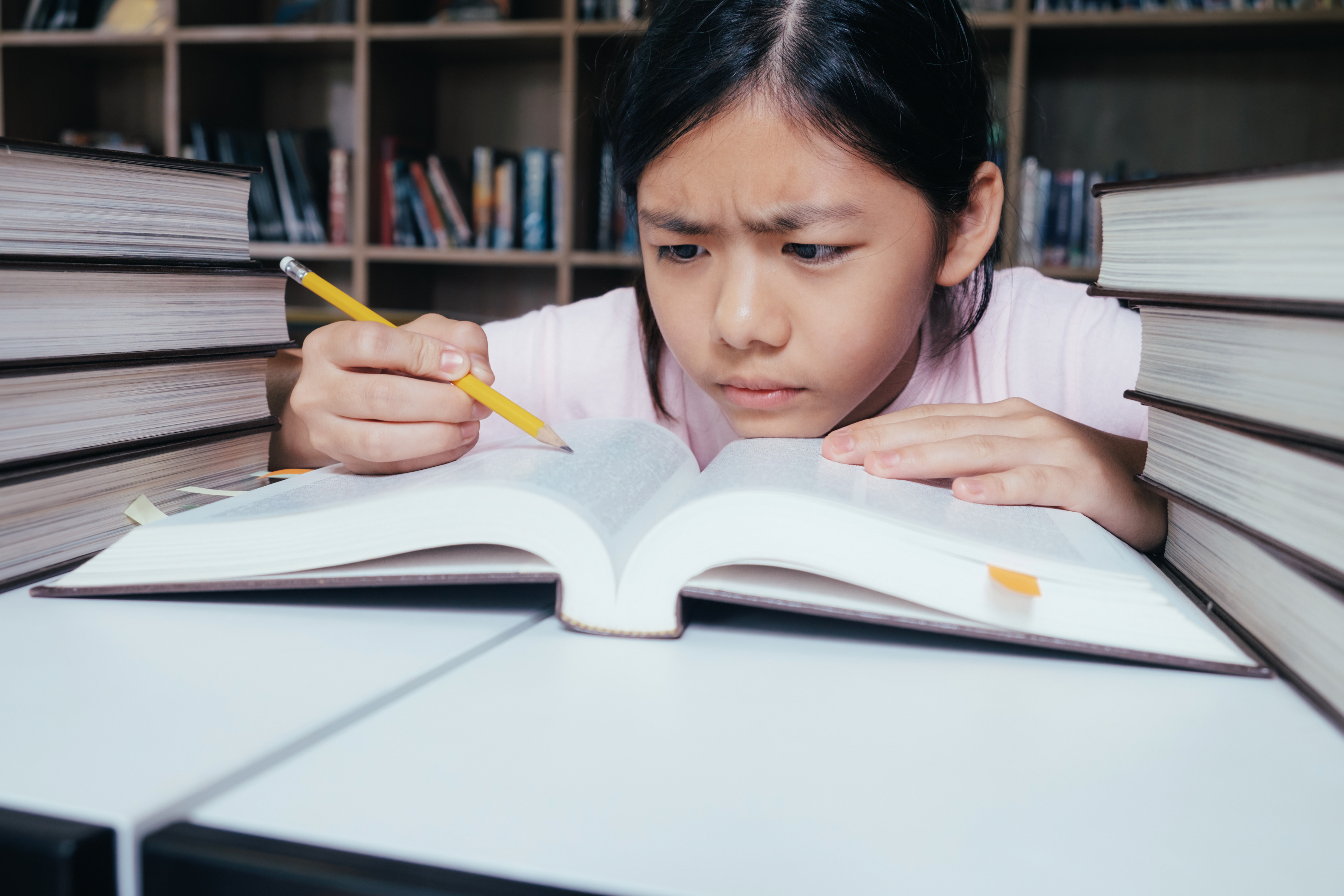 Girl Studying At Table