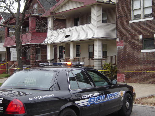 A police car is parked before the reside