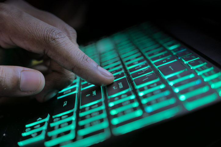 Close Up Of Hacker Hand Stealing Data