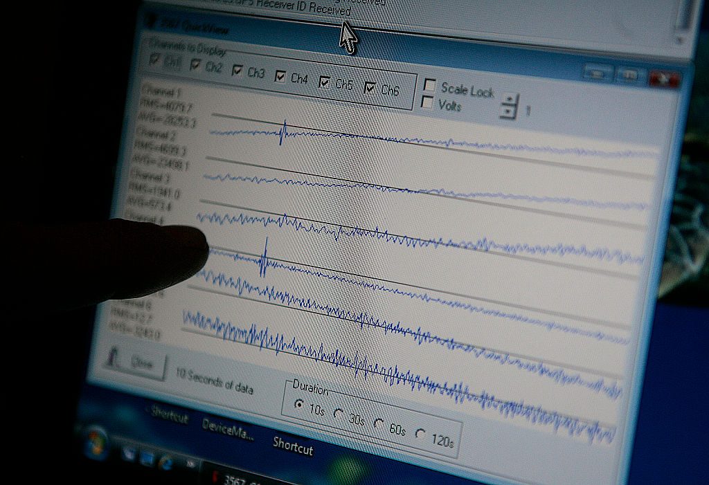 Sr. Instrumentation specialist David Johnson, points out reading from new earthquake equipment on h